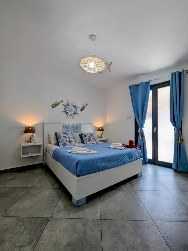 Postel nebo postele na pokoji v ubytování I colori della Sicilia