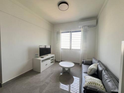 a living room with a couch and a table at Apartment for Rent in Phnom Penh