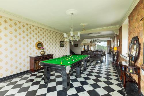 a billiard room with a pool table in it at SaffronStays Raj Reverie in Jaipur