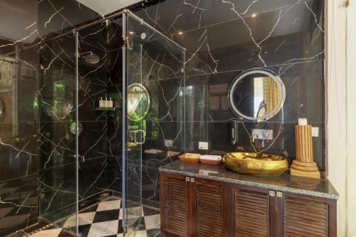 a bathroom with a sink and a shower at SaffronStays Raj Reverie in Jaipur