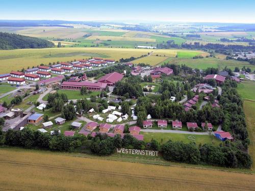 an aerial view of a town with houses and trees at Harz Holiday Park, Hasselfelde in Hasselfelde