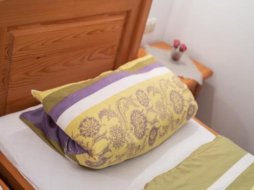 a pillow sitting on top of a bed at Spacious Apartment with Sauna in Schonsee in Dietersdorf