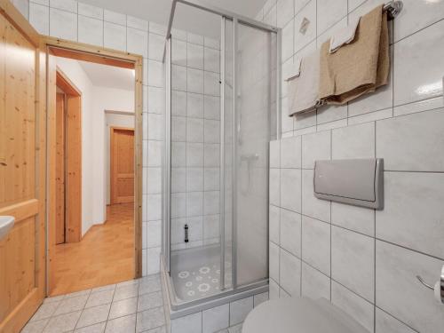 a bathroom with a shower and a toilet at Spacious Apartment with Sauna in Schonsee in Dietersdorf