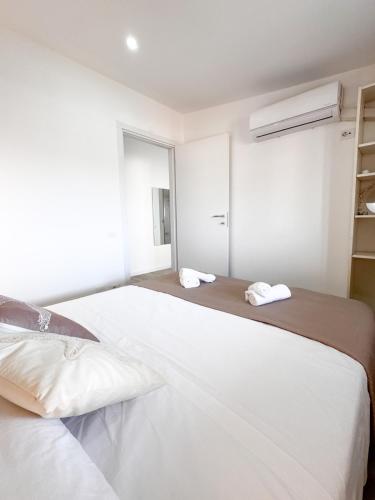 a bedroom with two beds and a window at Casa Romeo - Sea View Apartment in Focene