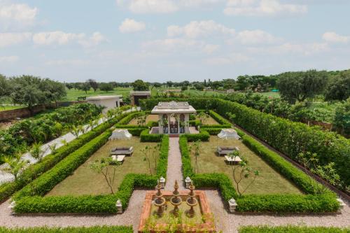 an aerial view of a garden with a building at SaffronStays Raj Reverie in Jaipur
