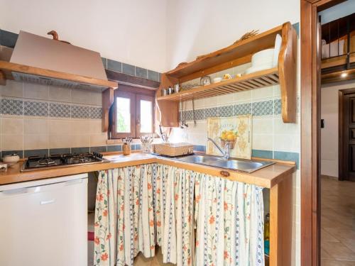 a kitchen with a sink and a counter top at Ancient holiday home in the countryside of Stilo with garden in Guardavalle