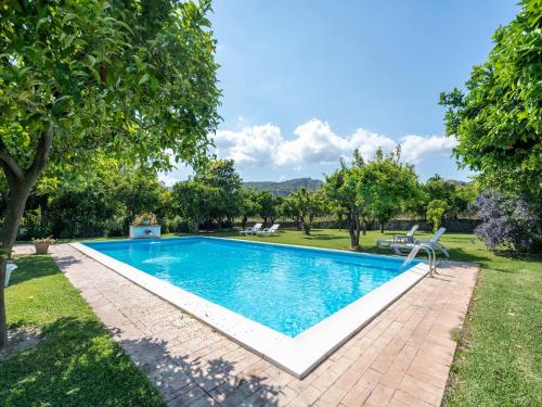 an image of a swimming pool in a yard at Ancient holiday home in the countryside of Stilo with garden in Guardavalle