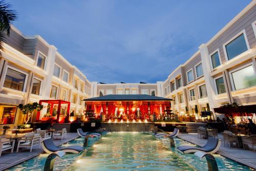 a large building with a pool in the middle of it at The Tivoli New Delhi in New Delhi