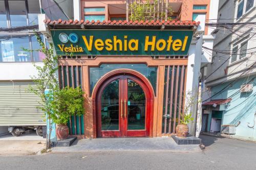 a restaurant with a sign for a vesta hotel at Veshia Hotel & Spa in Hanoi