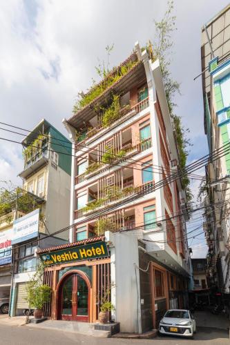 a building with plants on the side of it at Veshia Hotel & Spa in Hanoi