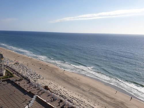 an overhead view of a beach with chairs and the ocean at Apartment on the Fischerhof, Vipperow in Vipperow