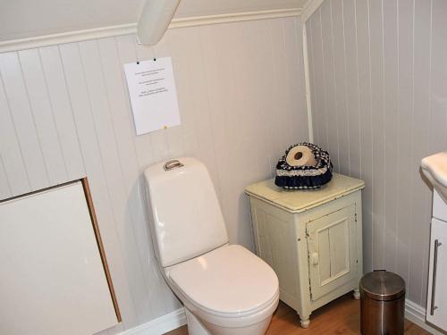 a bathroom with a white toilet and a sink at 10 person holiday home in Tornes I Romsdal in Tornes