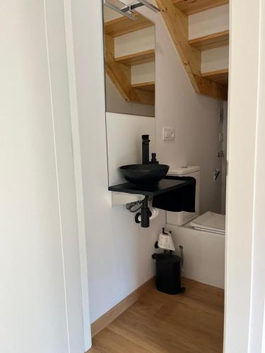 a bathroom with a sink and a toilet at A de Laura in Lariño