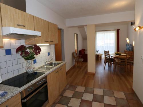 a kitchen with a sink and a counter top at Apartment in Bichlbach at the lake in Bichlbach