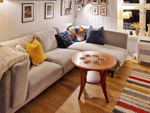a living room with a couch and a table at 7 person holiday home in Skutvik in Skutvika