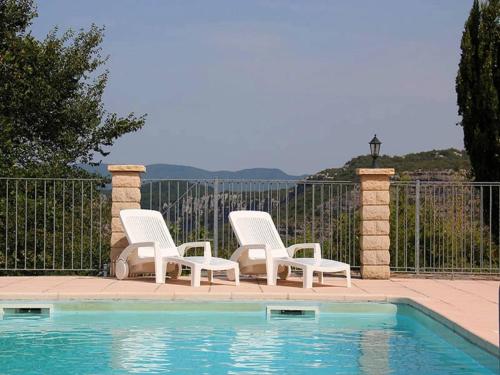 a group of three chairs and a swimming pool at Holiday Home in Toulon with Pool & Beach Nearby in Les Vans