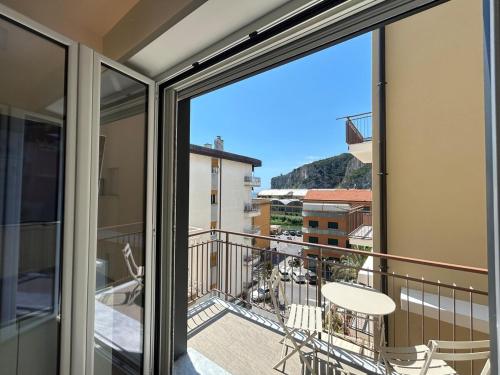 a balcony with a view of a city at Near the Sea in Finale Ligure