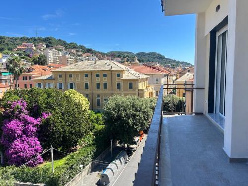 a balcony of a building with a view of a city at Near the Sea in Finale Ligure