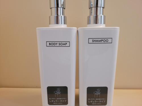 two white bottles sitting next to each other at Ema eve HOUSE in Tokyo