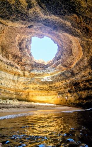 a view from inside of a cave with the sky at Linda Vista Mar T1, A-C, Wi-Fi, Porches in Porches