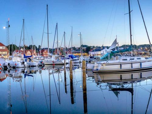 a group of boats docked in a harbor at 4 person holiday home in Allinge in Allinge