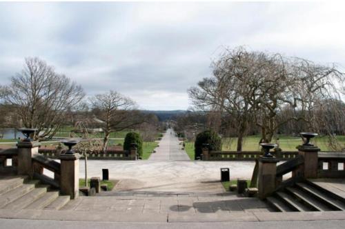 a park with benches and a long road at Double Deluxe Centre Apartment- Free Parking - Self Check-In - Cctv in Huddersfield