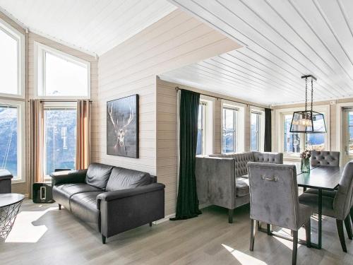 a living room with a couch and a table at 8 person holiday home in Valldal in Valldal
