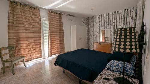 Ένα ή περισσότερα κρεβάτια σε δωμάτιο στο Aloja Centro Ayamonte