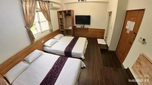 Gulta vai gultas numurā naktsmītnē Fengming B&B