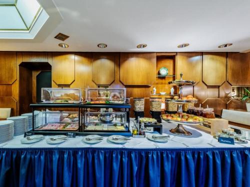 a buffet line with food on a table at Gästehaus Sophienstraße in Stuttgart