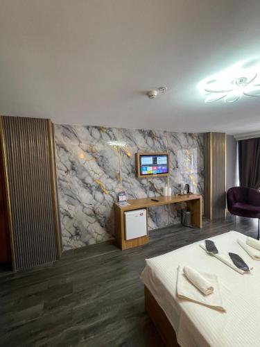 Waves hotelにあるテレビまたはエンターテインメントセンター