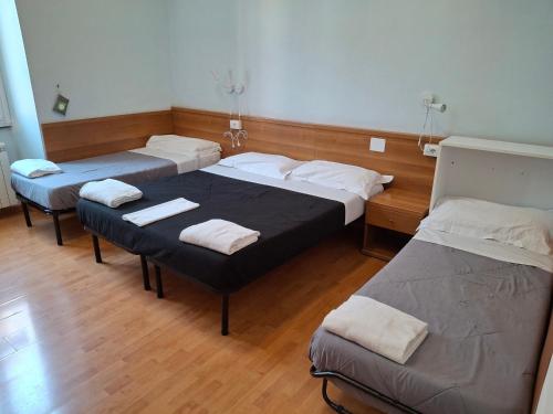 Ένα ή περισσότερα κρεβάτια σε δωμάτιο στο Hotel Big Bang