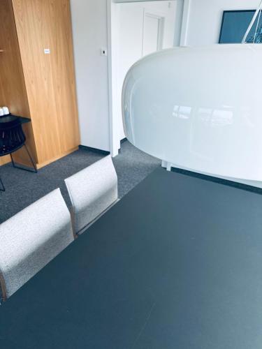 an empty room with a couch and a table at Scandic Parken in Ålesund