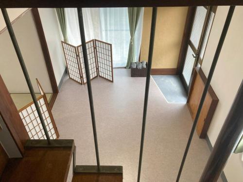 an overhead view of a room with stairs and windows at LT IZU Usami UMI in Ito