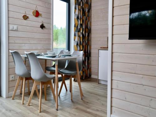 a dining room with a table and chairs at Comfortable house by the beach in Stepnica in Stepnica