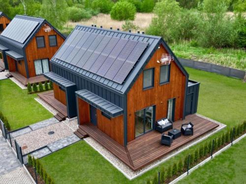 an overhead view of a house with solar panels on it at Comfortable house by the beach in Stepnica in Stepnica
