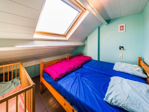 a small bedroom with a bed and a window at Han-sur-Lesse cottage in Han-sur-Lesse