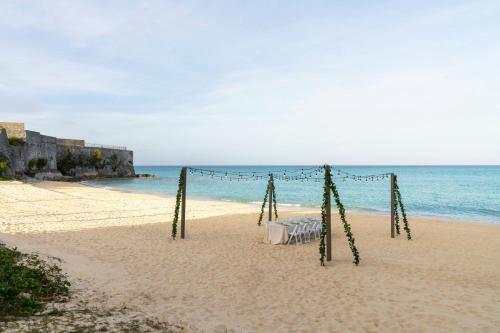 a wedding set up on the beach at The St. Regis Bermuda Resort in Saint George