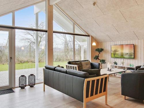 a living room with a couch and a table at 5 star holiday home in Kappeln in Kappeln