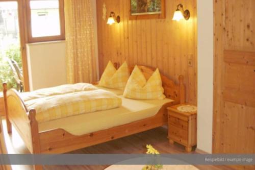 a bedroom with a bed with white sheets and pillows at Apartment at the Achensee in Achensee