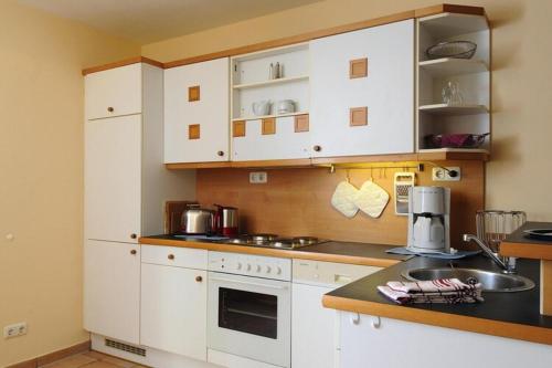 Kuchyň nebo kuchyňský kout v ubytování Appartements Post Hiddensee, Vitte