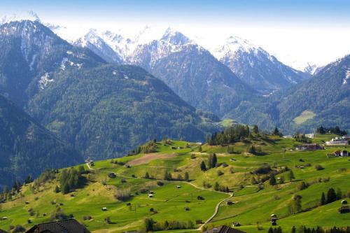 a green field with mountains in the background at holiday home, Fiss in Fiss