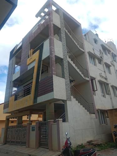 a building with the number seven painted on it at Single Bedroom Full independent house walkable distance to Dasarahalli Metro in Bengaluru