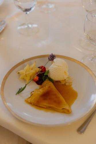 a plate of food with ice cream on a table at Landhotel Stähle in Schüttorf