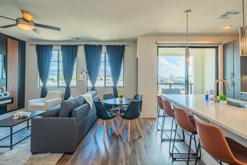 a kitchen and living room with a couch and a table at TPC Golf & Pool Peaceful Getaway in Kierland in Scottsdale