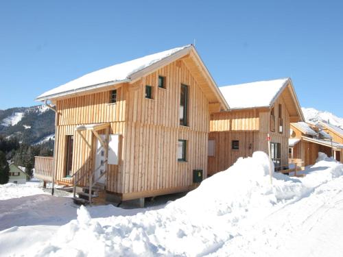 a wooden cabin in the snow with snow around it at Chalet in Hohentauern near Ski Lift in Hohentauern
