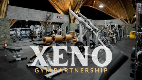 a gym with a bunch of equipment in a room at Susurro Villas in Kuta Lombok