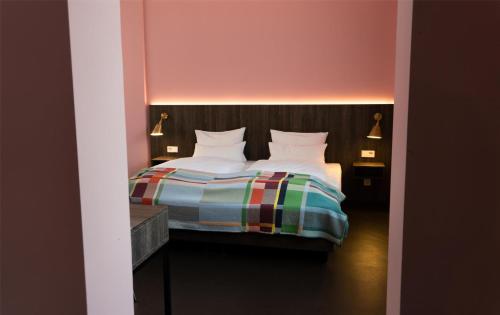 Postel nebo postele na pokoji v ubytování Central Hotel Münster