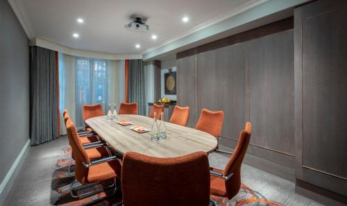 a dining room with a table and chairs at Clayton Hotel Charlemont in Dublin
