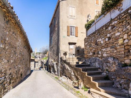 an alley with stairs leading up to a building at Vineyards & Village Stay in Minerve